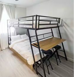 Full-size top and bottom bunk beds with a built-in table and two-wheel drawers!