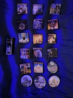 18 rare iron maiden pins and 1 Iron Maiden lighter