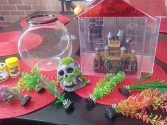 2 Fish Thanks. Plastic bowl. House With Blue Light( One Of The Corners Its A Lil Broken) 2 Betta Food. 1 Aqua Safe. 2 Houses casttle And Skull. 6 Fak