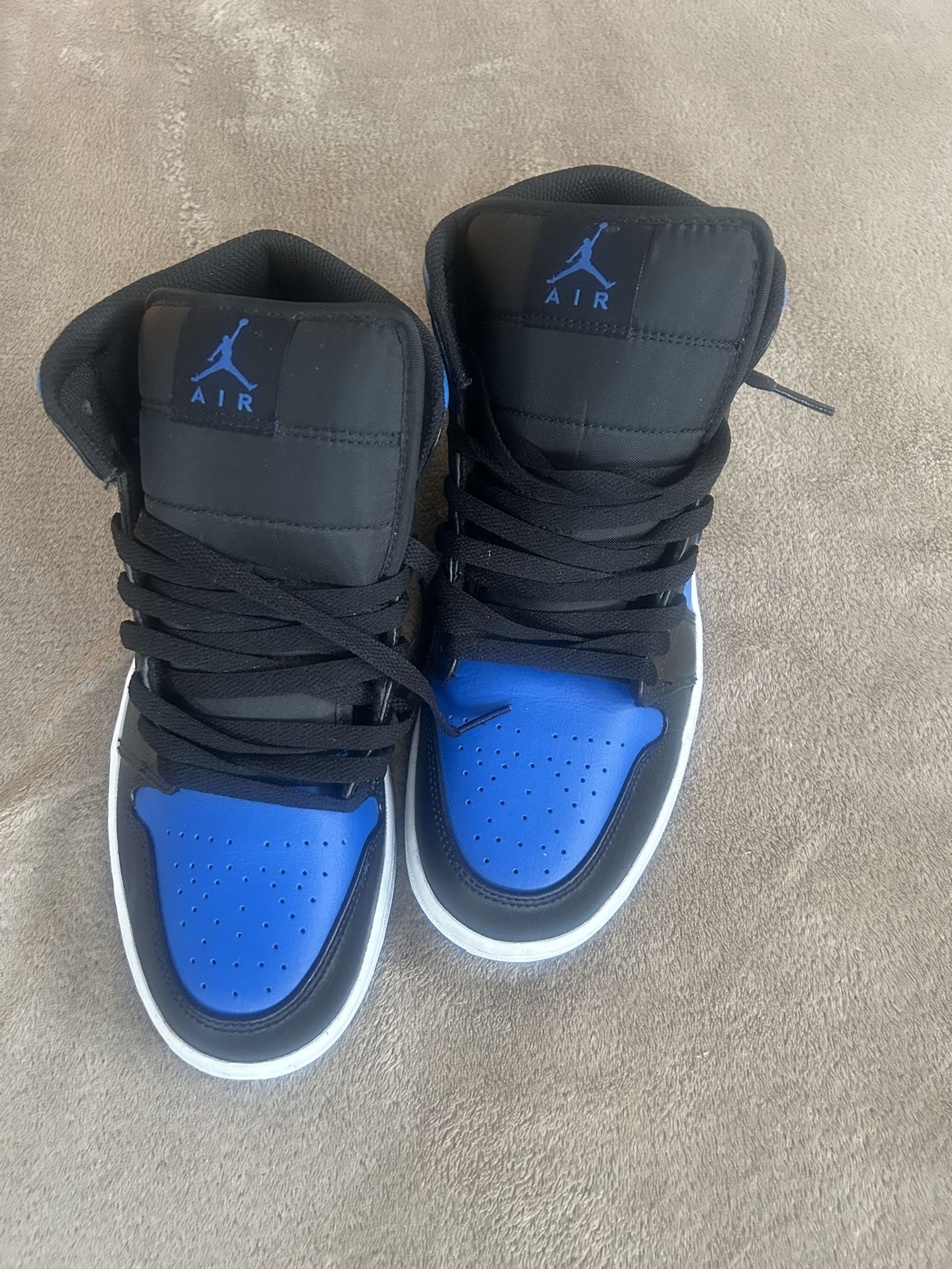 blue and black jordan’s