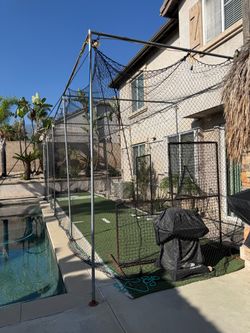 Backyard Batting Cage, screens, and pitching machine