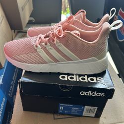 pink Adidas Questar Flow sneakers. 
