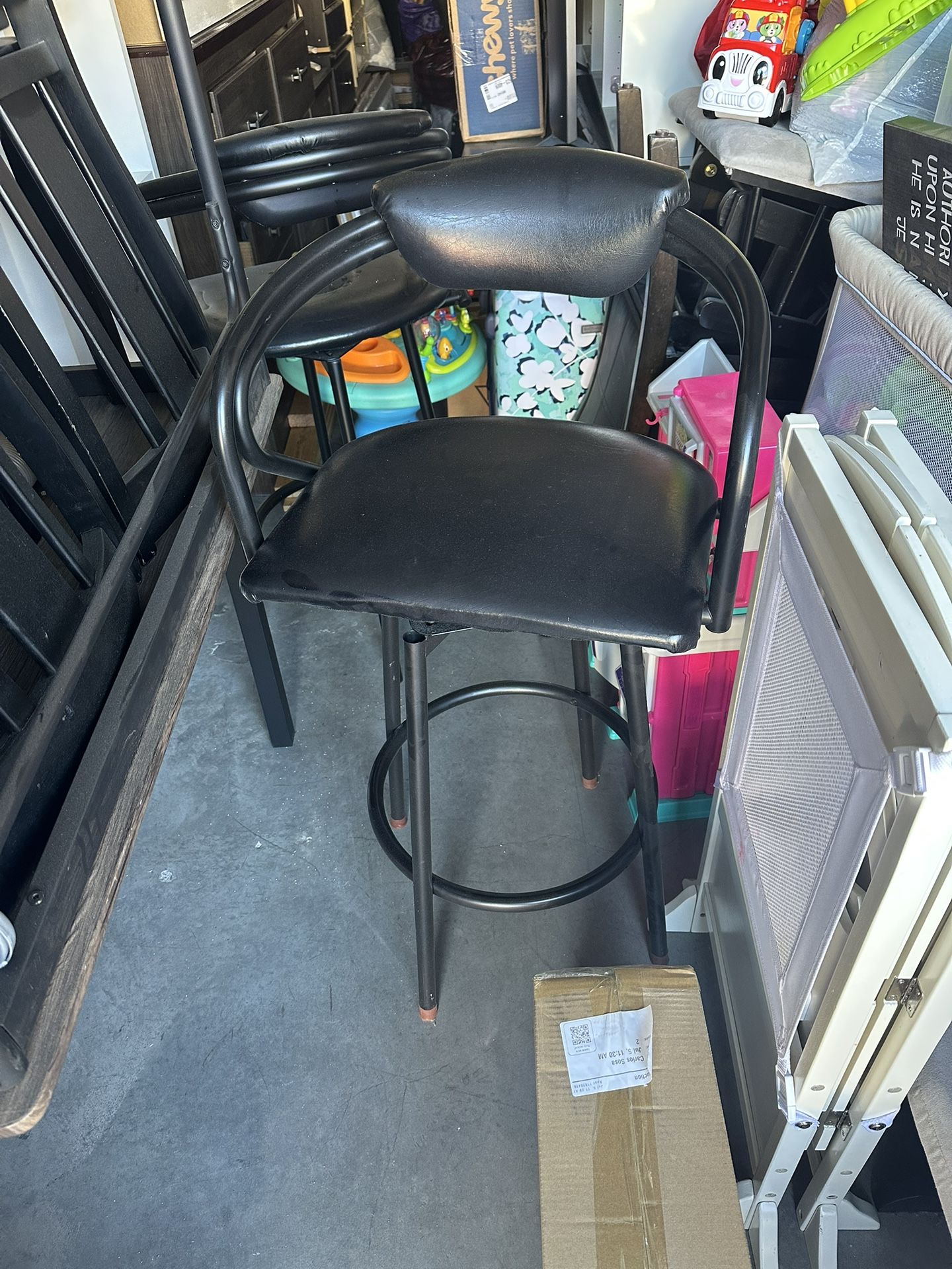 Three Black Swivel Bar Stools 