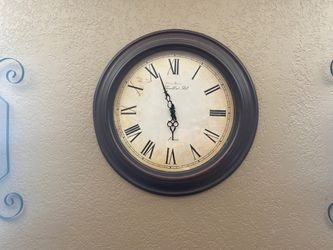 Wall clock and sconces