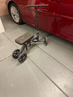 Black knee scooter mobility aid.