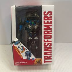 The image shows a Transformers Age of Extinction Lockdown One-Step Changer figure by Hasbro