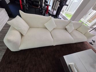124.5" W beige sofa