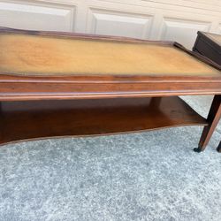 Beautiful Vintage Antique Coffee table with Leather Top Inlay and Underneath Shelf and steel casters
