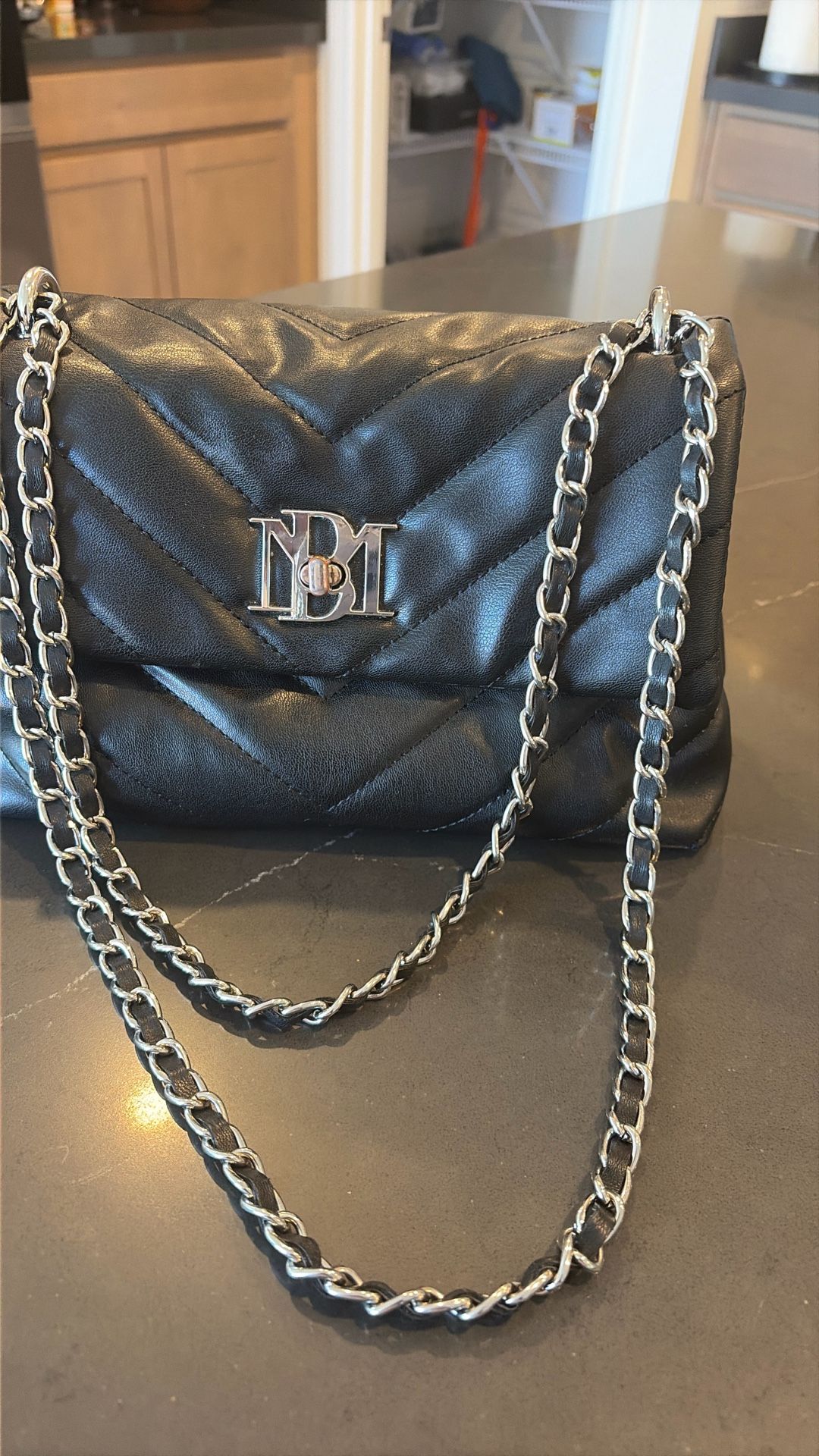 $25.00. Baffled Mischa Black crossbody bag