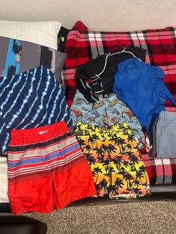 boy swim trunks and two swim shirts size 10/12