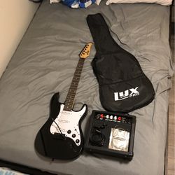 Lyx PRO Electric Guitar *USED TWICE* With Aux, Speaker, Tuner, Case, Backup Strings.
