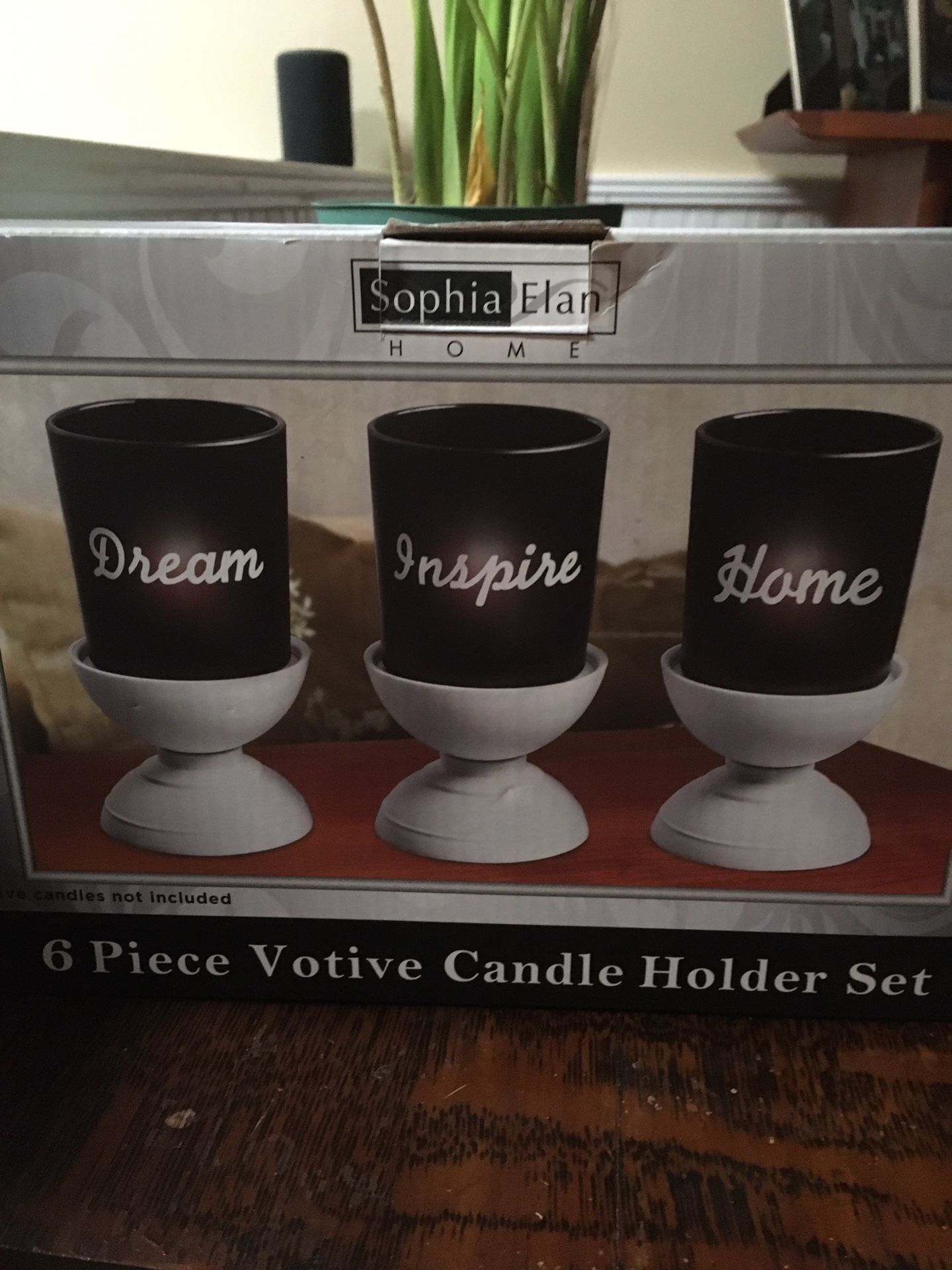 Brand new in box. 6 piece votive candle holder set