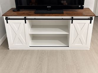 White bar style tv stand with sliding doors
