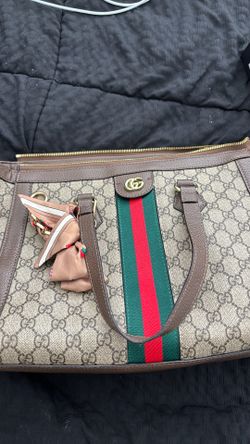 2 Gucci Supreme coated canvas and prominent red and green Web