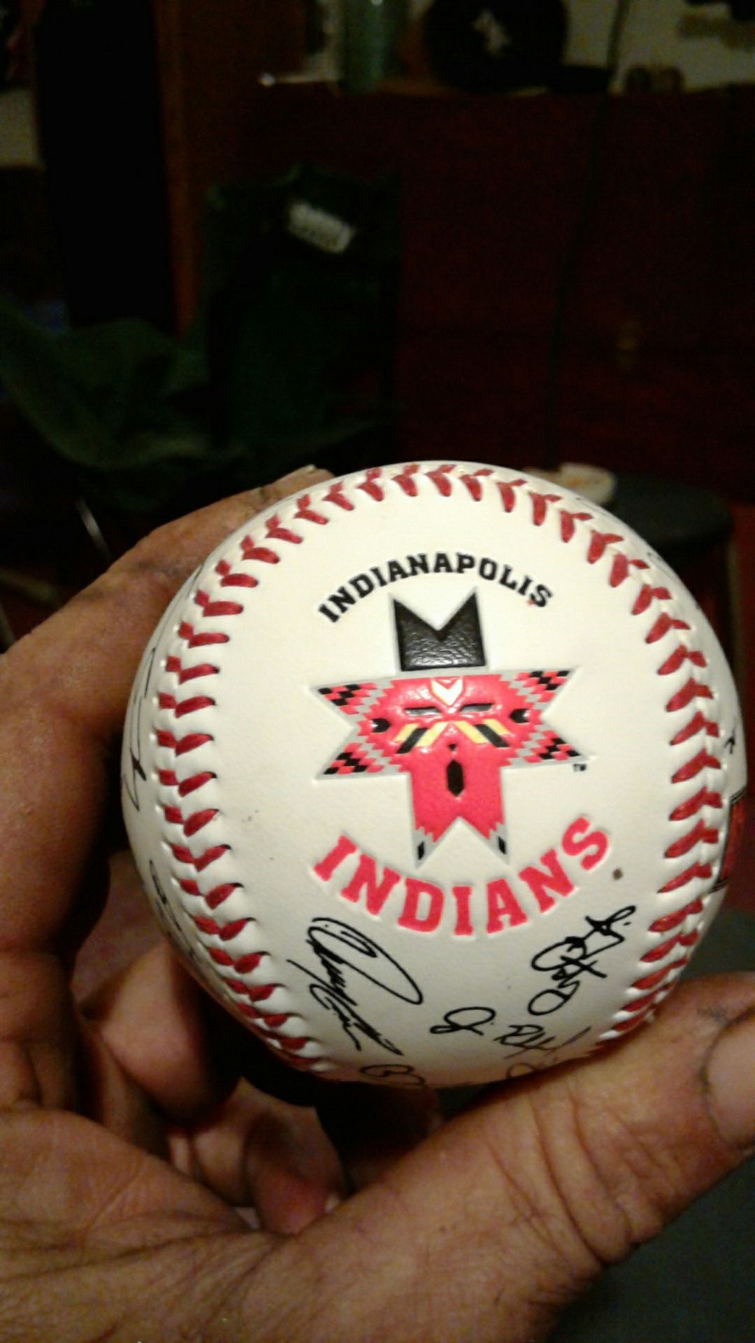 Indians team sign baseball