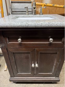 Small bathroom vanity with granite top and backsplash
