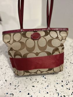 Coach signature stripe tote bag in tan canvas with red leather trim and matching apple charm
