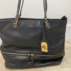 Genuine Ralph Lauren black leather handbag. With gold hardware.