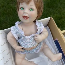 Elke Hutchins Lil Punkin Porcelain Baby Doll Green Eyes Danbury mint 11x7x7   Measurements are approximate   Preowned. Has been taken out of the box. 