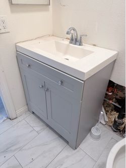 Gray vanity comes with countertop