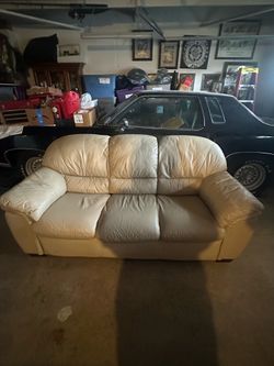 3 person nude light brown couch used in good condition.