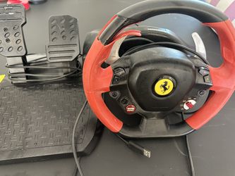 PlayStation Thrustmaster Ferrari Racing Wheel w/pedals.