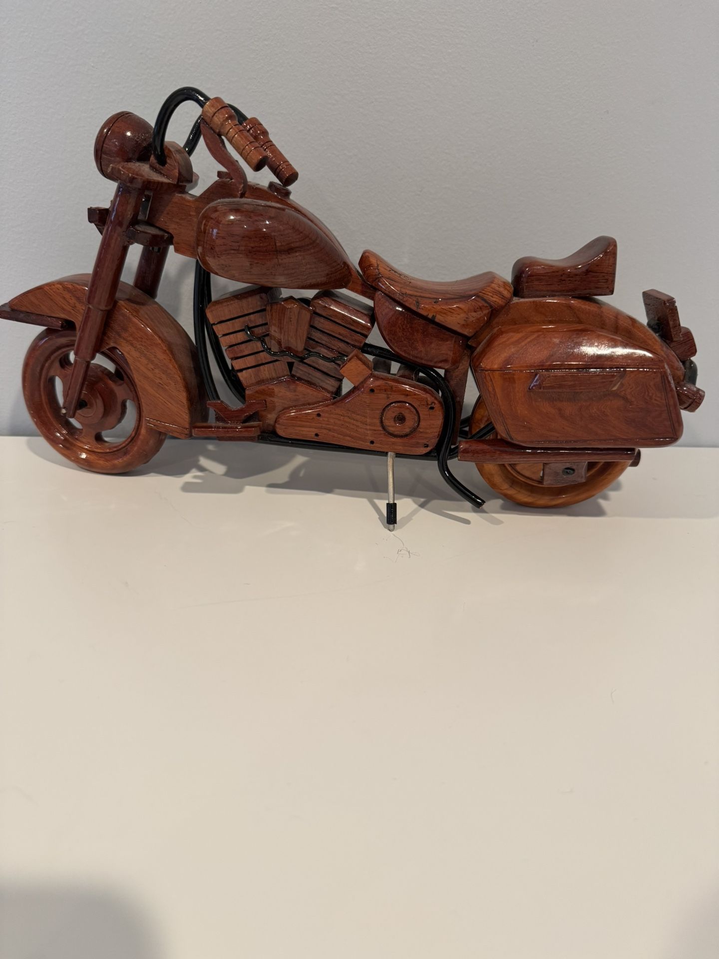 This Harley Davidson Heritage High Back motorcycle is handcrafted from solid mahogany