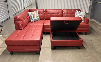 Red leather sectional couch and ottoman