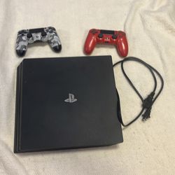 PlayStation 4 with 2 controllers and wire