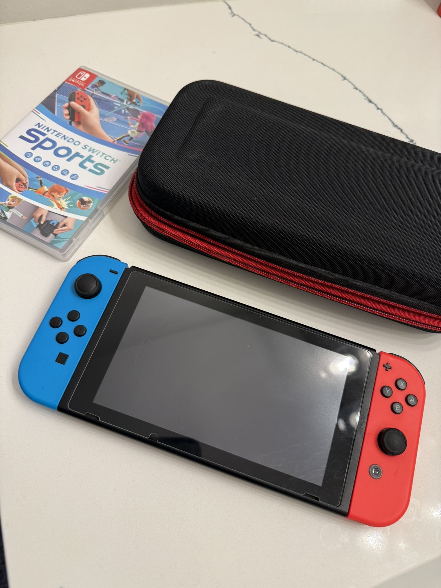Nintendo Switch with case and Sports Game