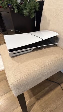 PS5 with controller and stand 