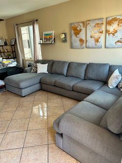Large Grey sectional couch from Jerome’s super comfortable LIKE NEW