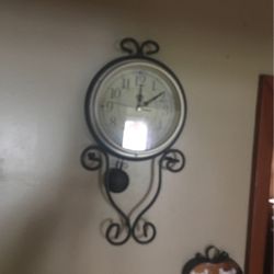 Nice Wrought iron frame with pendulum like now