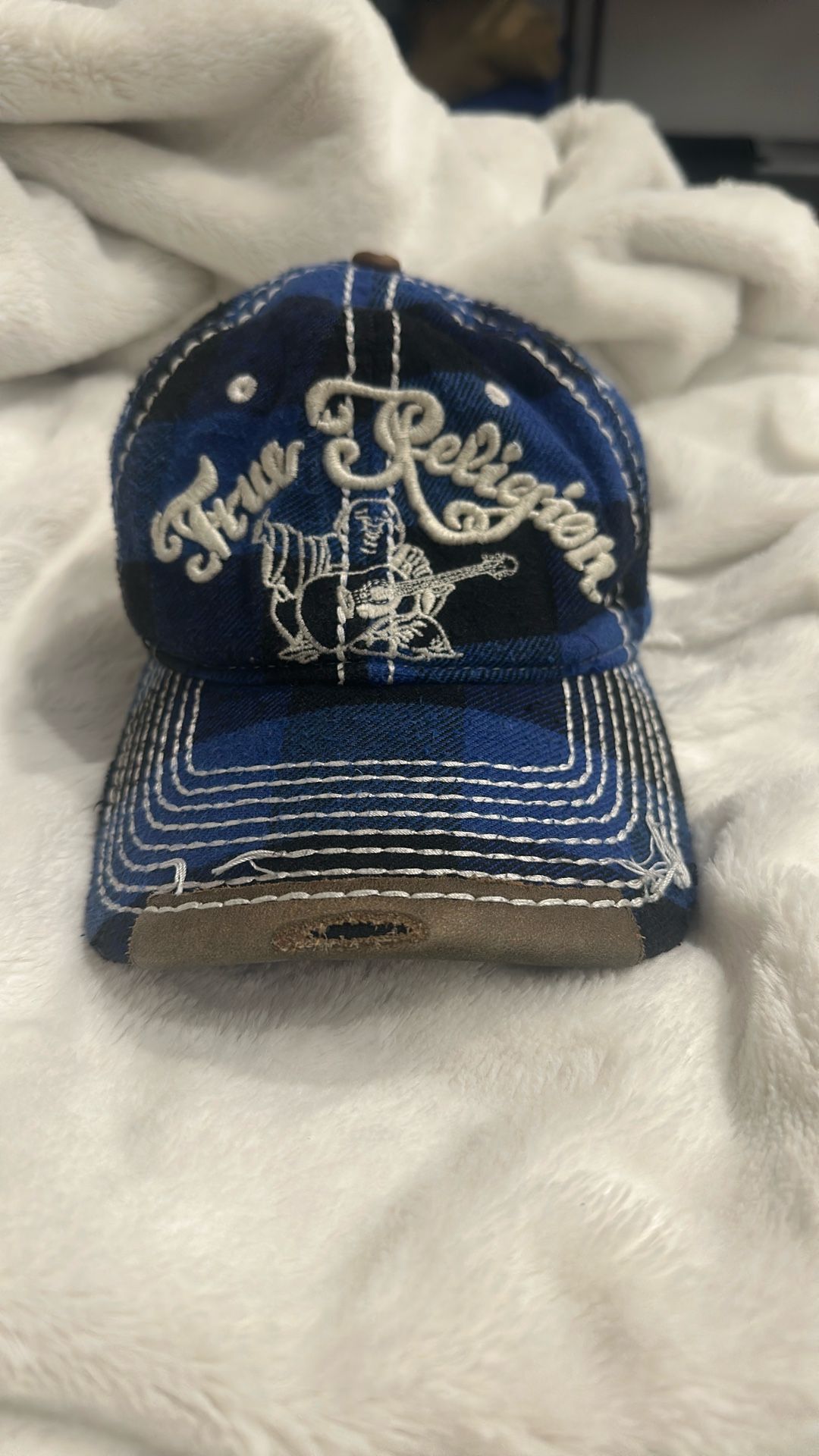 True Religion cap with blue and black plaid Features