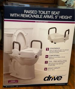 Raised toilet seat (fits more elongated toilet)