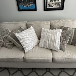 8ft (7.5) Tan couch with Pillows