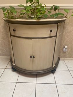 Selling a beautiful hallway/entryway table, was painted “leaves imprints still visible on left door”