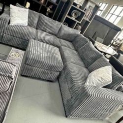 Gray Jumbo corduroy sectional sofa with ottoman