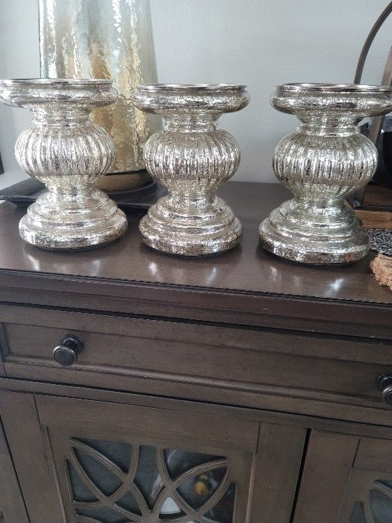 2 Different Sets Of Candle Holders