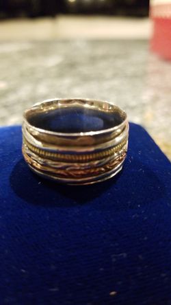 Silver ring with 4 loose bands around