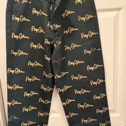 Trousers with a repeating Peep Game brand logo.