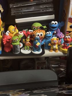 collection of various Sesame Street character figures.