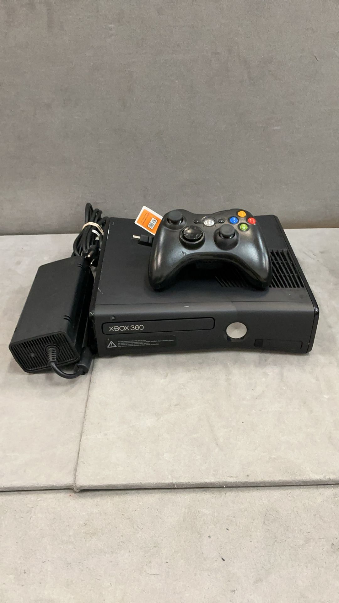 Xbox 360 with one controller and chords