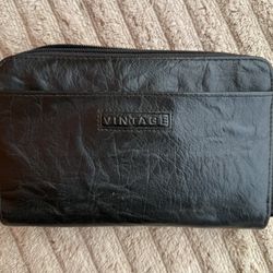 Dark Brown zip-around wallet with a "VINTAGE" logo plate.