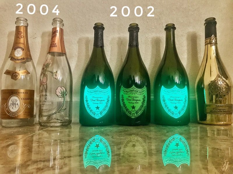 Lot of EMPTY High end champagne bottles. Dom Perignon Luminous, Cristal
