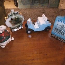 FOUR EMPTY COLLECTIBLE CERAMIC DECANTERS
