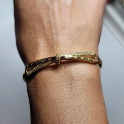 Beautiful goldtone bangle with rhinestones. New