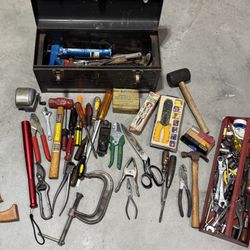 Craftsman tool box stuffed with tools.
