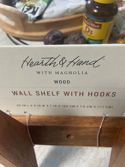 Wall shelf with hooks