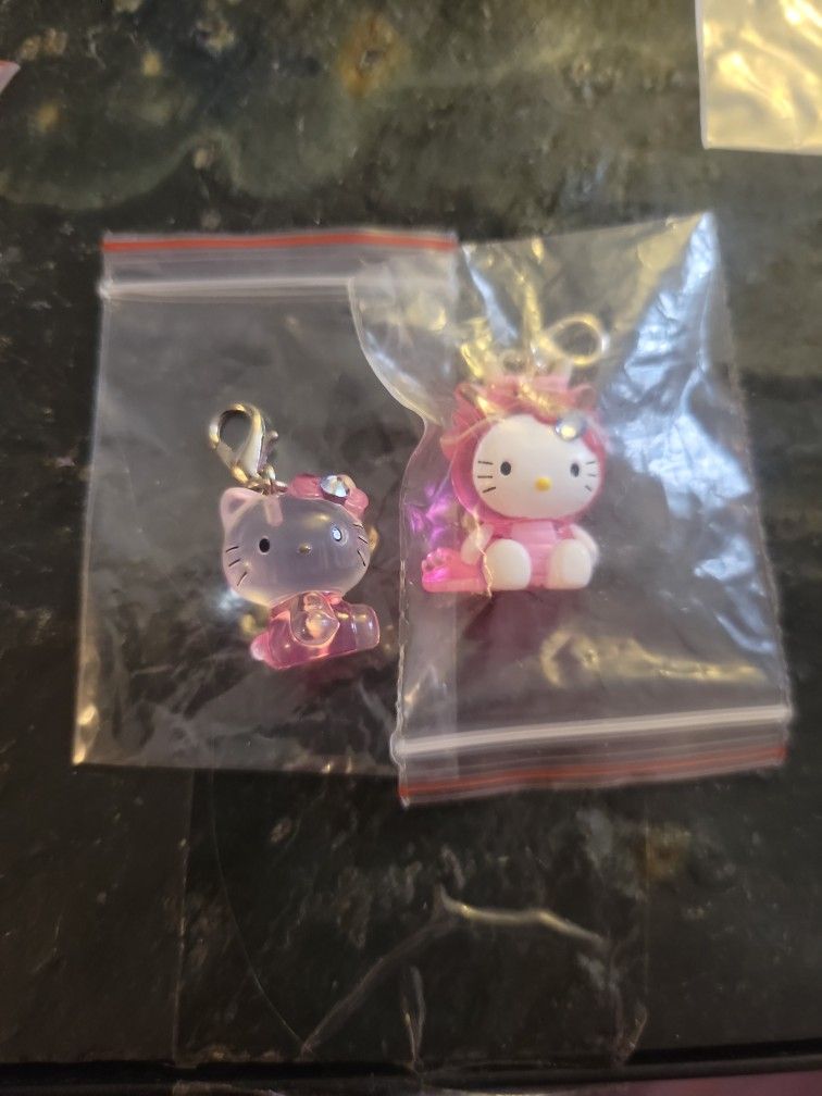 Two hello kitty charms